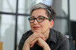 © Andrii Zastrozhnov - Close-up portrait of a senior smiling woman in glasses.