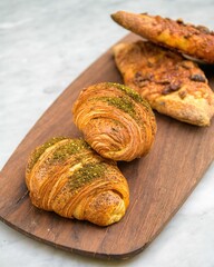 Poster - Freshly baked bread on a wooden plate