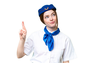 Poster - Airplane stewardess over isolated chroma key background with fingers crossing and wishing the best