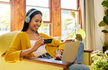Happy Woman, Laptop And Credit Card With Ecommerce And Headphones To Listen To Music While Online Shopping. Female Relax At Home, Radio Streaming With Fintech, Internet Banking And Payment Success
