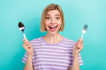 Sticker - Photo of funny impressed girl short hairstyle striped t-shirt hold spoon fork staring open mouth isolated on turquoise color background