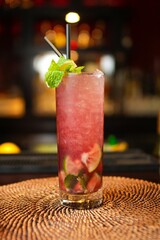 Poster - Vertical closeup of a refreshing citrusy cocktail on a bar counter