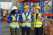 © FotoArtist - Multiethnic industrial workers checking their logistic lists while working with transportation of goods in warehouse