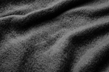 texture of warm woolen fabric with folds. gray wavy felt back.