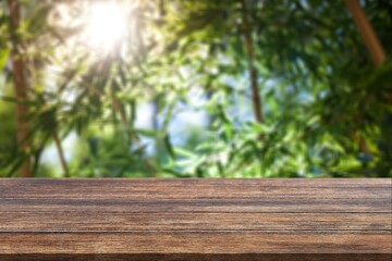 Sticker - Rustic wooden texture desk on blur forest background