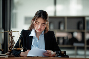 lawyer businesswoman working and notary signs the documents at the office. consultant lawyer, justic