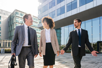 Wall Mural - Multiethnic business people meeting in a business park - Multiracial group of corporate colleagues 