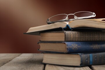 Wall Mural - Old books for reading on wooden desk