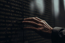 A Close-up Of A Hand Touching A Name On A War Memorial, Reflecting On The Life Lost. Memorial Day Generative AI