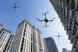 3d illustration of drones flying above high rise buildings