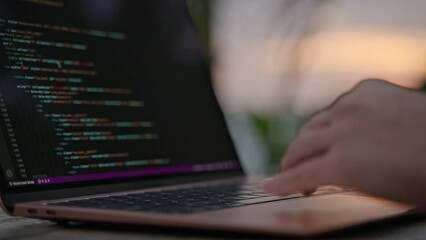 Female developer working on laptop by the ocean. Young woman freelancer coding at outdoor tropical cafe. Caucasian girl working remotely typing on computer at exotic location close-up. Worldwide work.