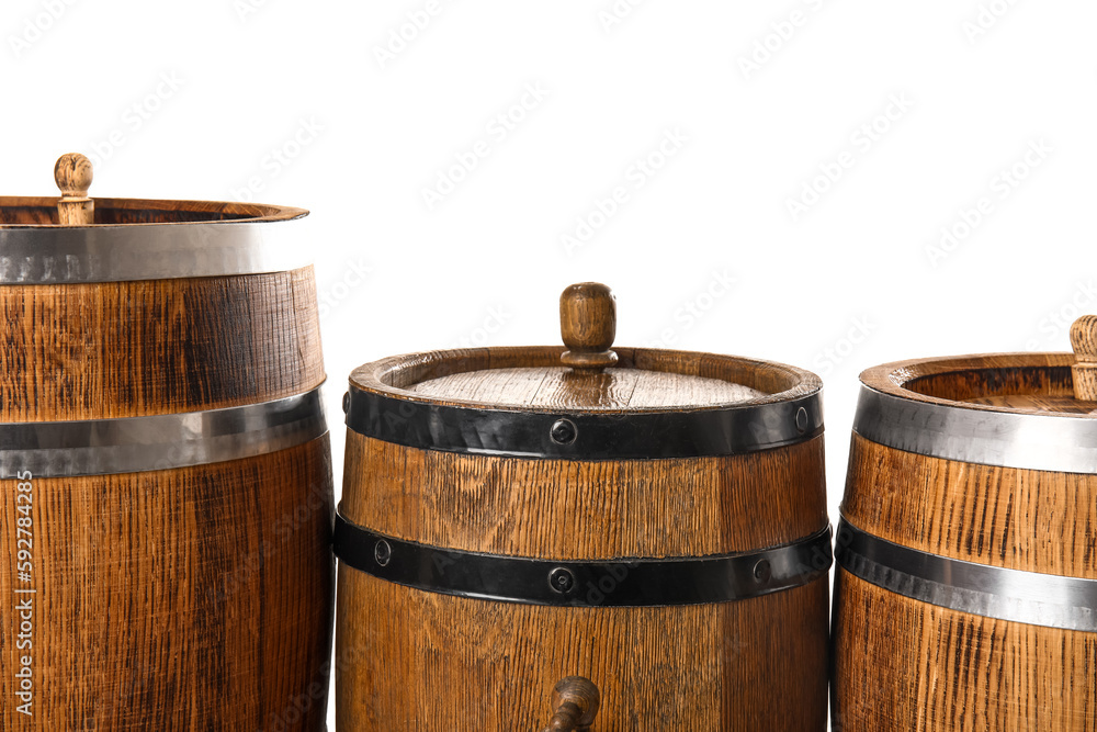 Oak barrels with metal hoops isolated on white background