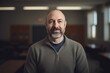 © Robert MEYNER - Portrait of a mature man standing in an office looking at the camera