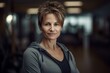© Robert MEYNER - Portrait of a middle-aged woman with short hair in a gym