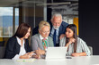 © FS-Stock - Mature businessman leader mentor talking to diverse colleagues team listening to caucasian ceo.