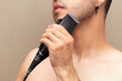© Narayan - man with hair clipper, haircut concept