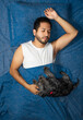 © Narayan - latin man sleeping in bed with his friend dog, sleep concept