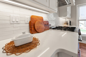 Wall Mural - Modern Minimalism Kitchen Design with White Tiles, Quartz Countertops, and Stainless Steel Appliances