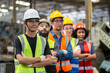 © eakgrungenerd - group of engineer professional successful team corporate workers standing in factory. teamwork technician inspector manufacturing industry workplace.