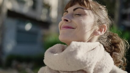 Poster - Young caucasian woman smiling confident enjoying sun at street