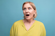 close-up portrait of a shocked middle aged blond woman