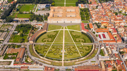 Wall Mural - Aerial view of the Royal Palace of Caserta also known as Reggia di Caserta. It is a former royal residence with large gardens in Caserta, near Naples, Italy. The historic center of the city is nearby.