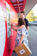 © Austockphoto - Young person with a disability using post office lock box in town