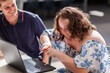 © Austockphoto - Happy young person with a disability using hands to talk in AUSLAN australian sign language
