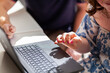 © Austockphoto - Girl with a disability using laptop technology to learn with one on one help