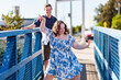 © Austockphoto - Happy teenage girl with down syndrome dancing on blue footbridge