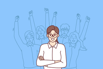 Wall Mural - Woman leader standing with arms crossed near team located behind and making victorious wave of hands. Businesswoman leader or company manager posing for advertising banner of consulting corporation