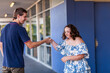 © Austockphoto - Handshake of congratulations between teen with down syndrome and support worker
