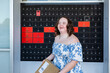 © Austockphoto - Happy young person with a disability holding brown box parcel near post office