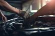 © Kateryna - Mechanic using wrench while working on car engine at garage workshop, Car auto services and maintenance check concept
