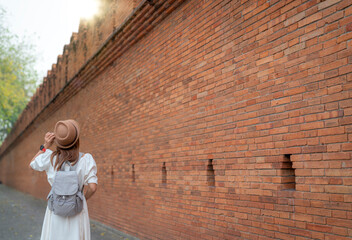 Wall Mural - Asian traveller woman walking on the street of Chiang mai