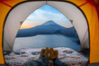 Traveller couple sweet sleep in tent camping with Fuji mountain view outside