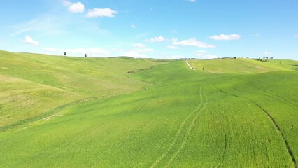 Wall Mural - Flying over the amazing rolling hills of Tuscany Italy in springtime