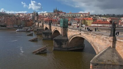 Wall Mural - Scenic spring panoramic aerial view of the Old Town pier architecture and Charles Bridge over Vltava river in Prague, Czech Republic