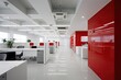 © Iryna - White and red office interior, comfortable workplaces. Generative ai.