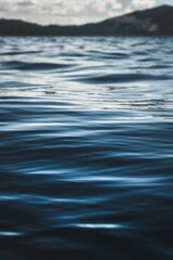 Vertical closeup of dark blue water texture at Lake Tahoe, California