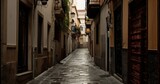 Fototapeta Uliczki - empty street in an old part of a city in Spain. Generative AI