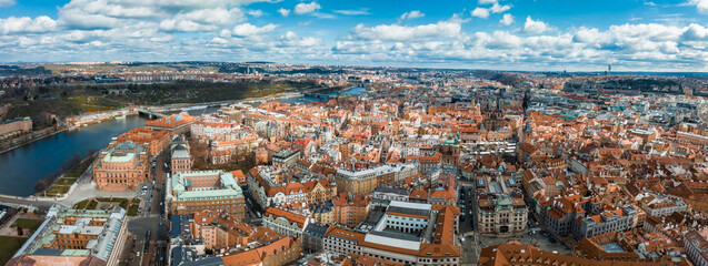 Wall Mural - Scenic spring panoramic aerial view of the Old Town pier architecture and Charles Bridge over Vltava river in Prague, Czech Republic
