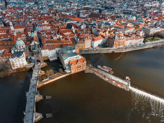 Wall Mural - Scenic spring panoramic aerial view of the Old Town pier architecture and Charles Bridge over Vltava river in Prague, Czech Republic