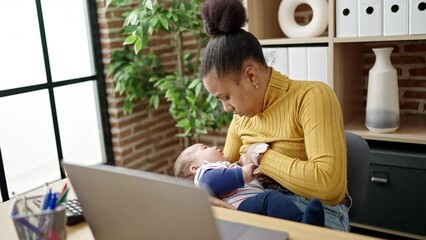 Wall Mural - Mother and son business worker working while breastfeeding baby at home