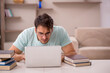 © Elnur - Young male student preparing for exams at home