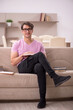 © Elnur - Young male student preparing for exams at home
