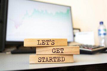 Wall Mural - wooden blocks with words 'let's get started'. business concept