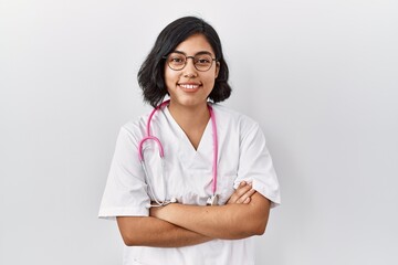 Canvas Print - Young hispanic doctor woman wearing stethoscope over isolated background happy face smiling with crossed arms looking at the camera. positive person.