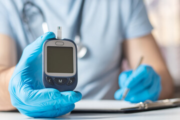 the doctor shows the level of sugar in the blood and enters them into the patient's medical form, Mockup