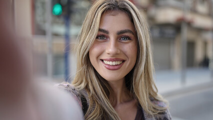 Sticker - Young blonde woman smiling confident making selfie by camera at street